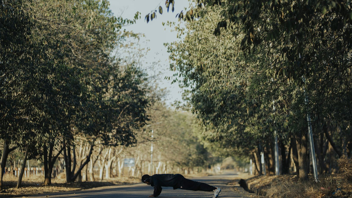 A man doing push-ups outdoors