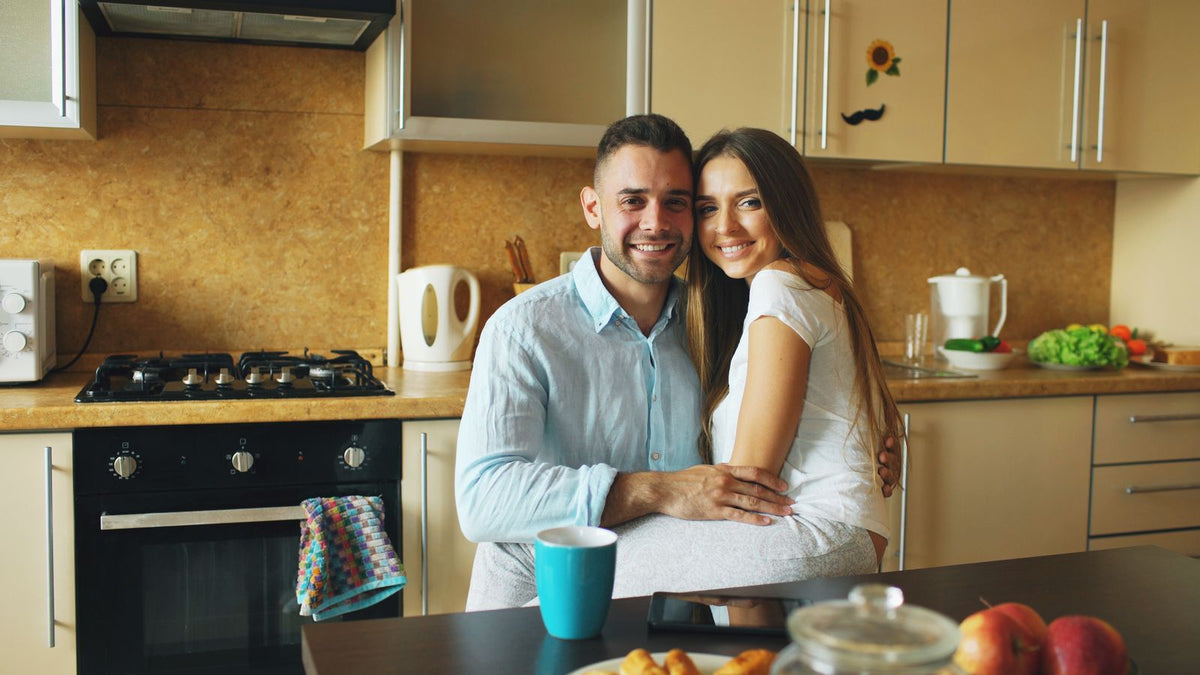 A happy couple close in the kitchen