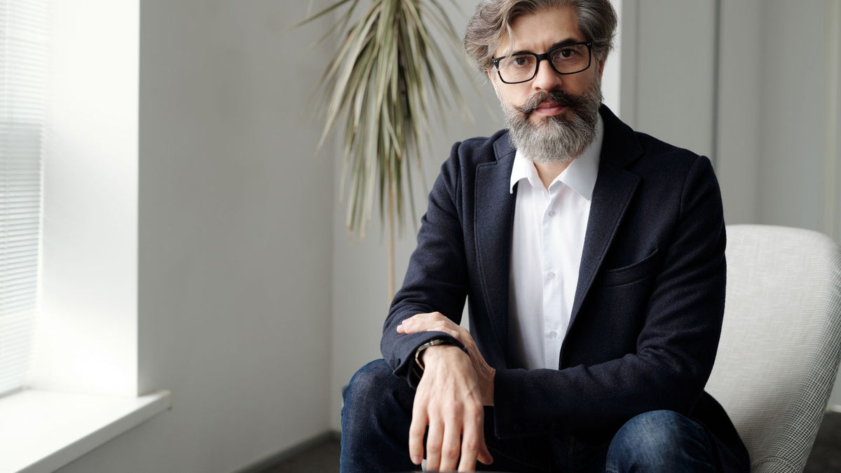 A mature man sitting and thinking