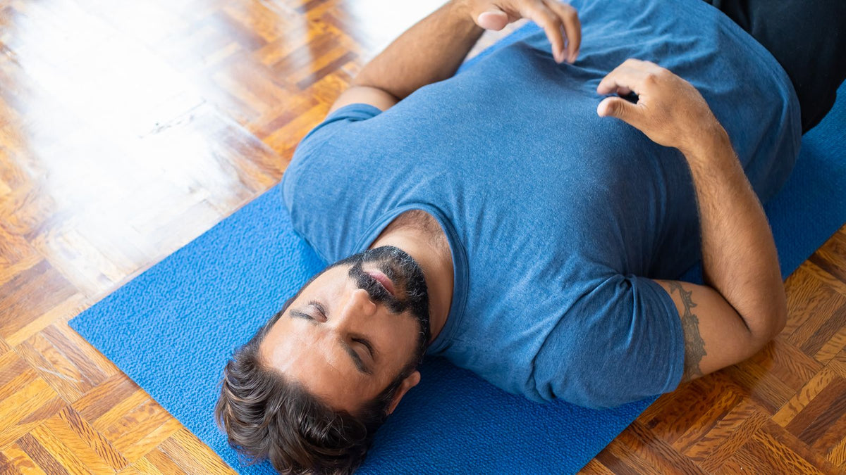 A man doing a slow breathing exercise