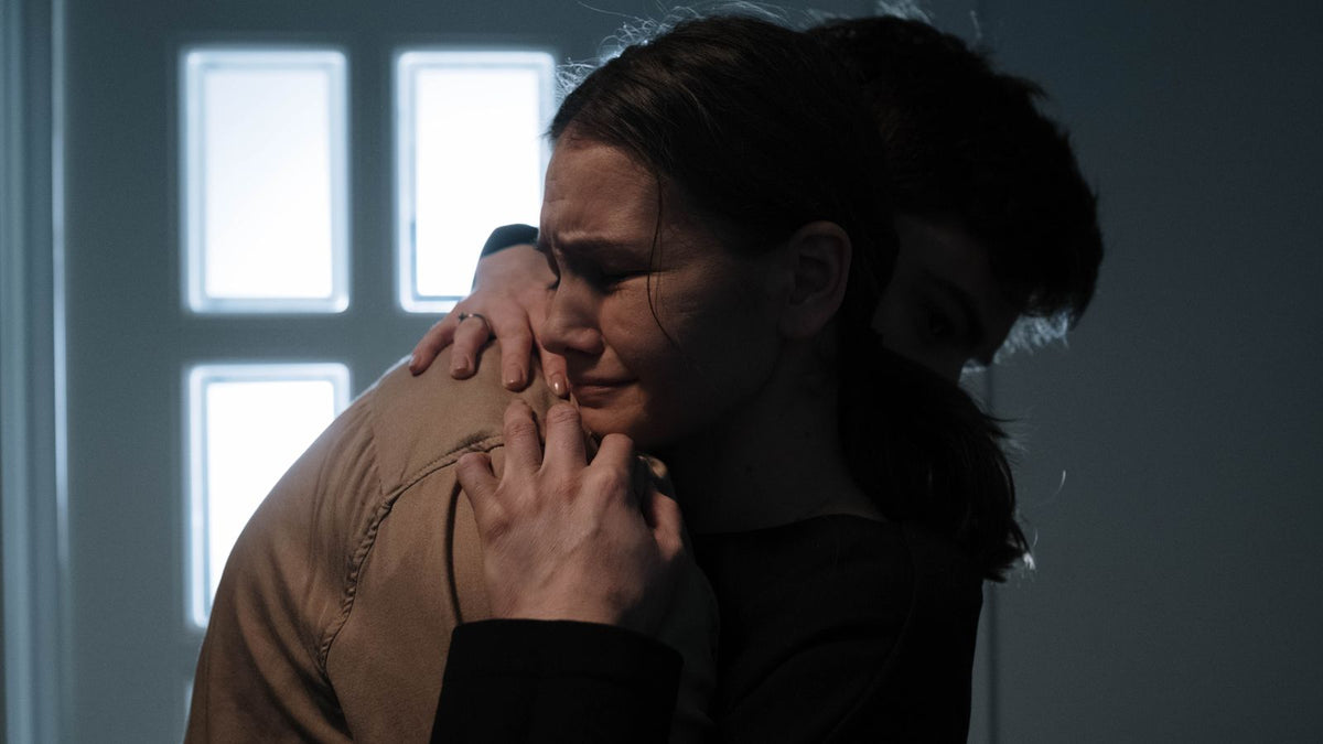 A couple sharing a tender comforting embrace