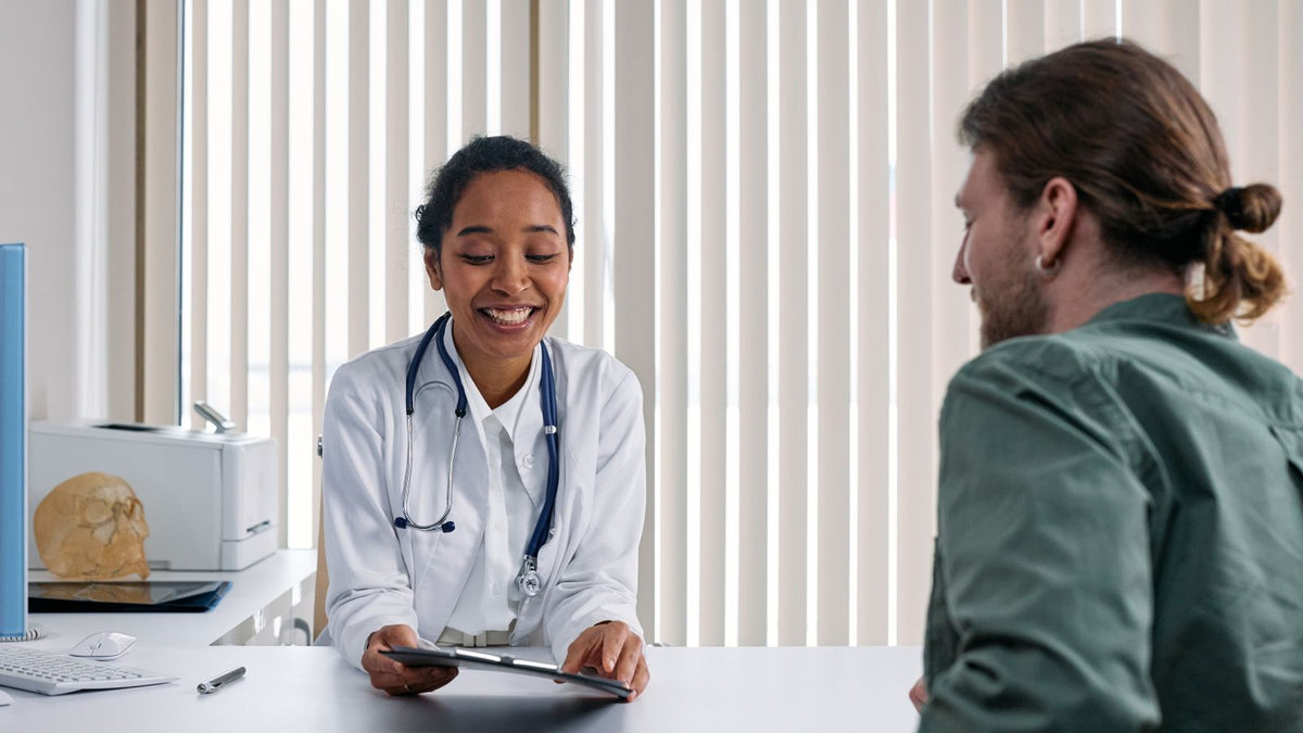 A doctor talking with a patient